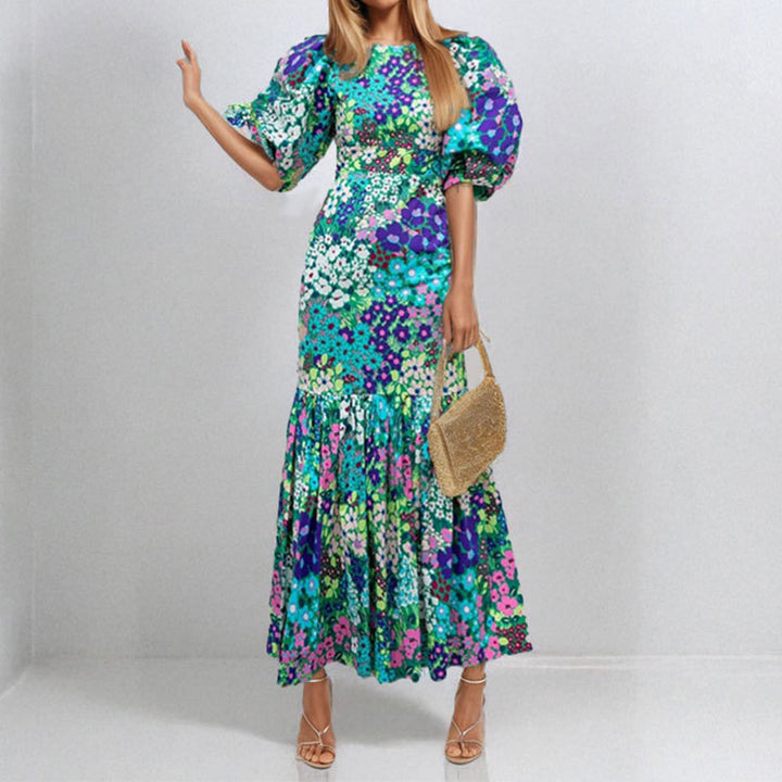 Robe maxi pour femmes avec des manches bouffantes volumineuses et des motifs floraux Chic & Stil