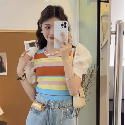 Women's short sleeve top with sophisticated puff sleeves and colorful striped pattern