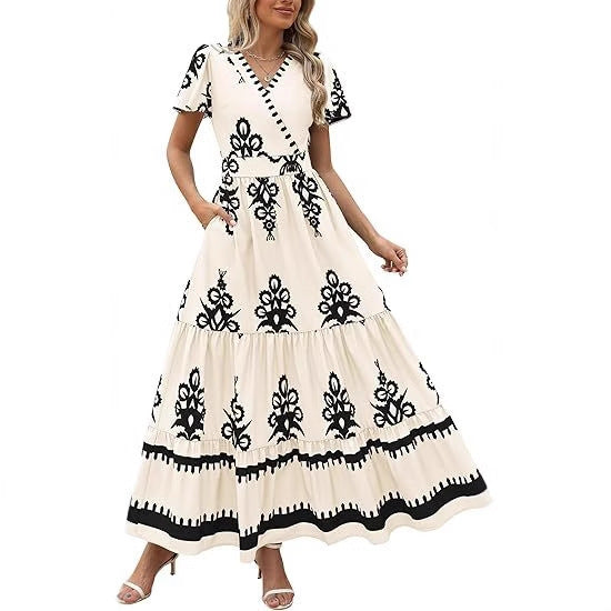 Maxi dress for women with V-neckline and contrasting embroidery details Lune London
