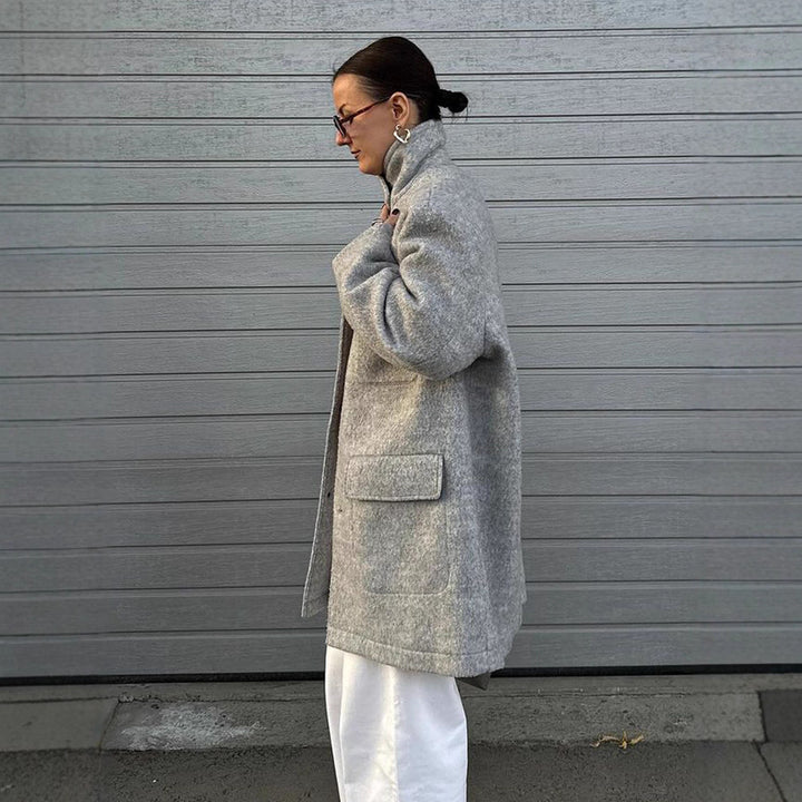 Women’s wool blend coat in boxy style with shirt collar, applied flap pockets, and button closure Amarae