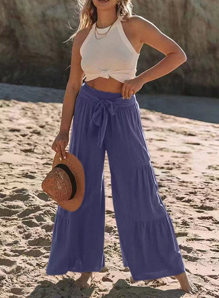 Airy palazzo pants for women with elastic waistband and practical tied belt Lune London