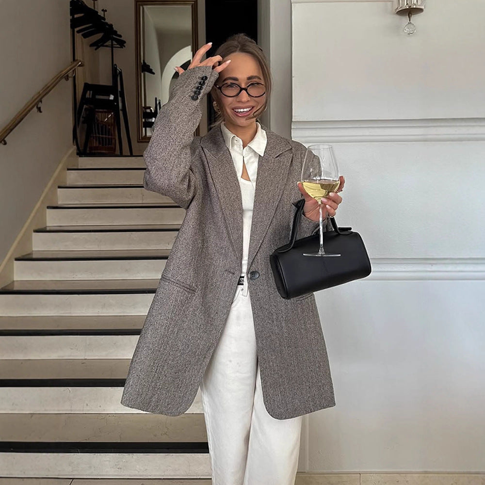 Women's long oversized wool blend coat with single-breasted button placket, notched lapels, and side pockets Amarae