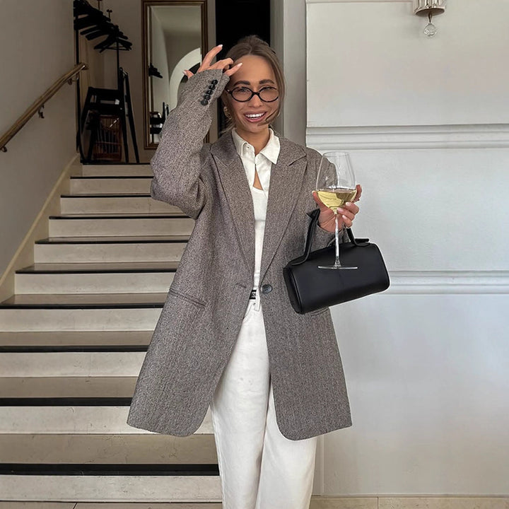 Women's long oversized wool blend coat with single-breasted button placket, notched lapels, and side pockets Amarae