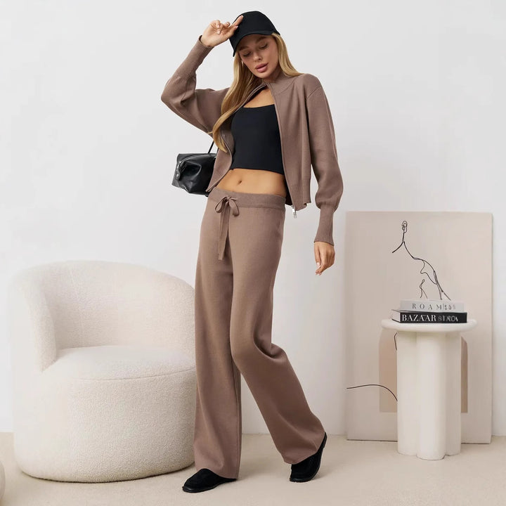 Ladies comfortable knit jumpsuit with high collar and side lace details Lune London