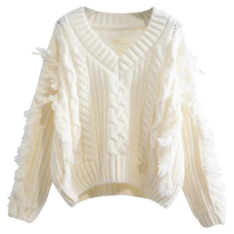 Knit pullover for women with eye-catching fringes and a chic cable knit pattern