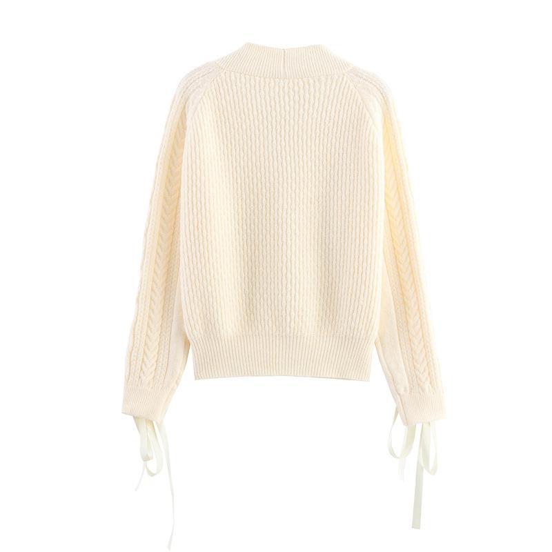 Knitted jacket for women with a detailed textured pattern and elegant ruffle details Lune London