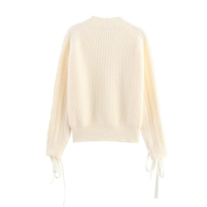 Knitted jacket for women with a detailed textured pattern and elegant ruffle details Lune London
