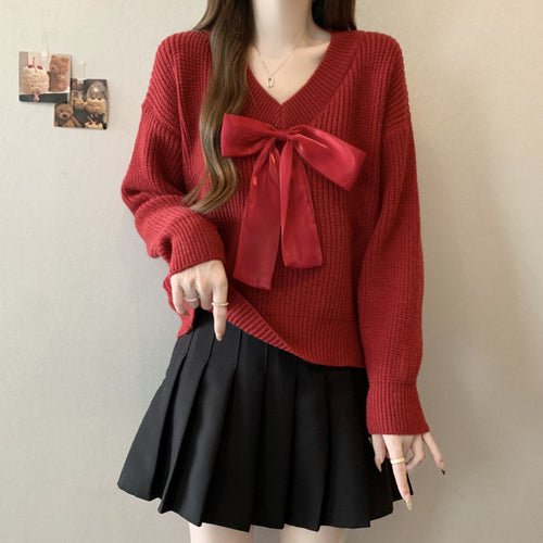 Knitted sweater for women with V-neck and decorative bow accent Amarae