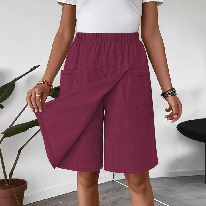Mid-length wrap skirt for women with elastic waist and practical pockets Lune London