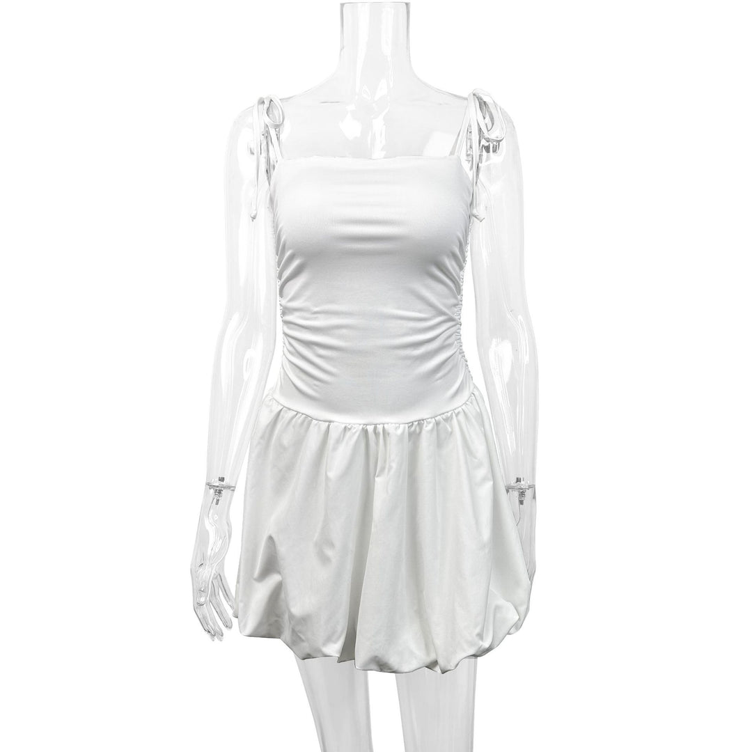 Women's playful mini dress with adjustable spaghetti straps and sophisticated ruffle hem Lune London