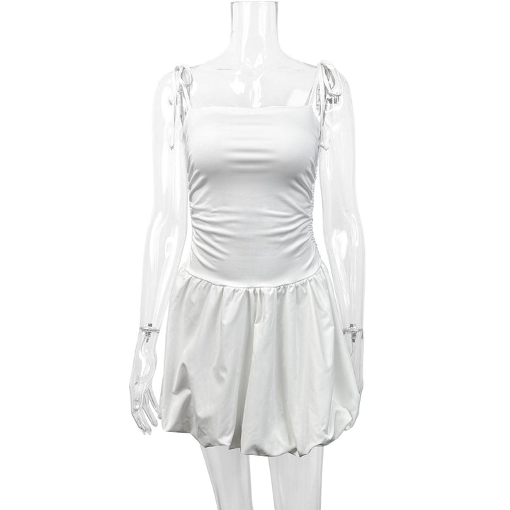 Women's playful mini dress with adjustable spaghetti straps and sophisticated ruffle hem Lune London