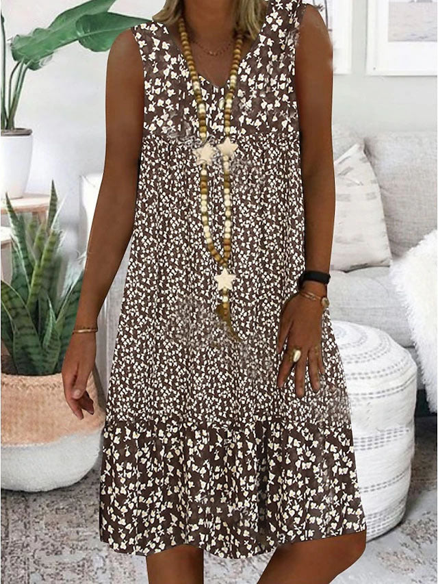 Airy summer dress for women with a playful floral pattern and a fluid silhouette Lune London