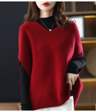 Knitted poncho for women with V-neck and chic elegant silhouette