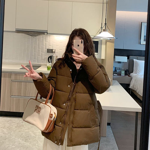 Women's quilted winter jacket with high collar and side pockets