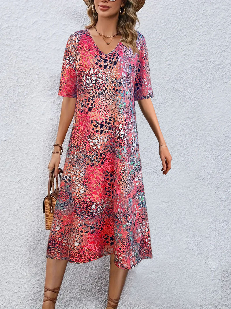 Fluid midi dress for women with eye-catching abstract patterns Lune London