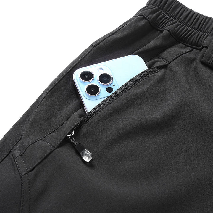 Men's softshell pants for outdoor with pre-shaped knees, integrated belt and zippered pockets Amarae