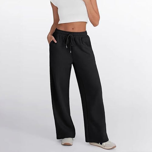 Women's loose leisure pants with elastic waistband and functional side pockets Chic & Stil