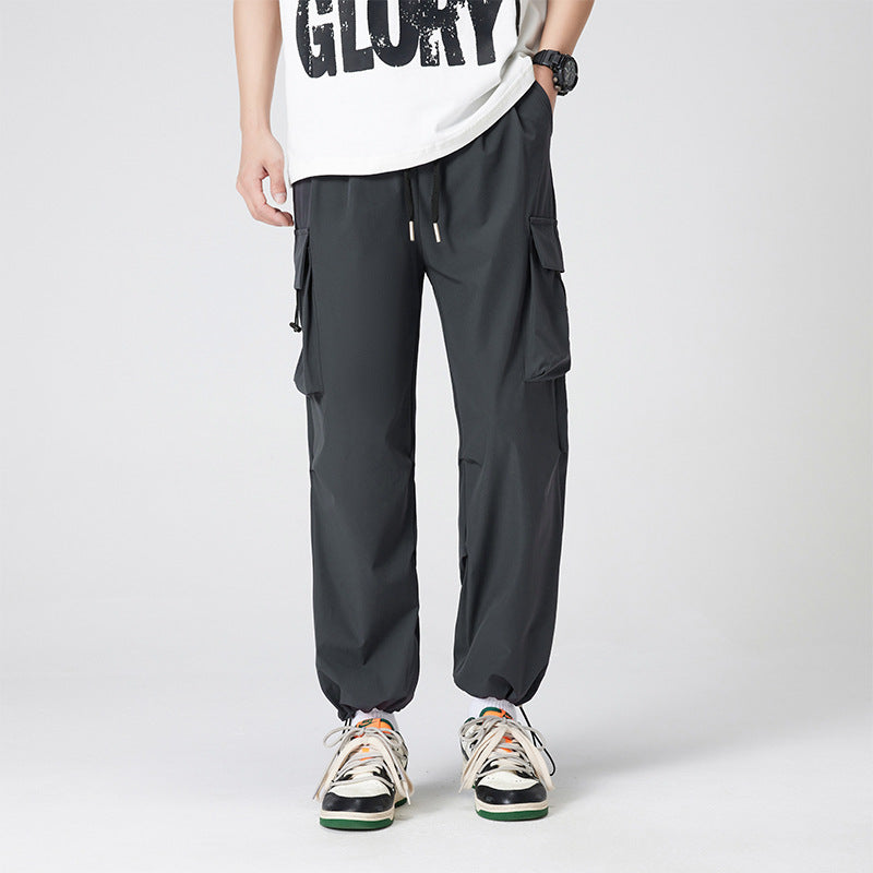 Women’s cargo pants in outdoor style with drawstring waistband, large side pockets, and adjustable hem.