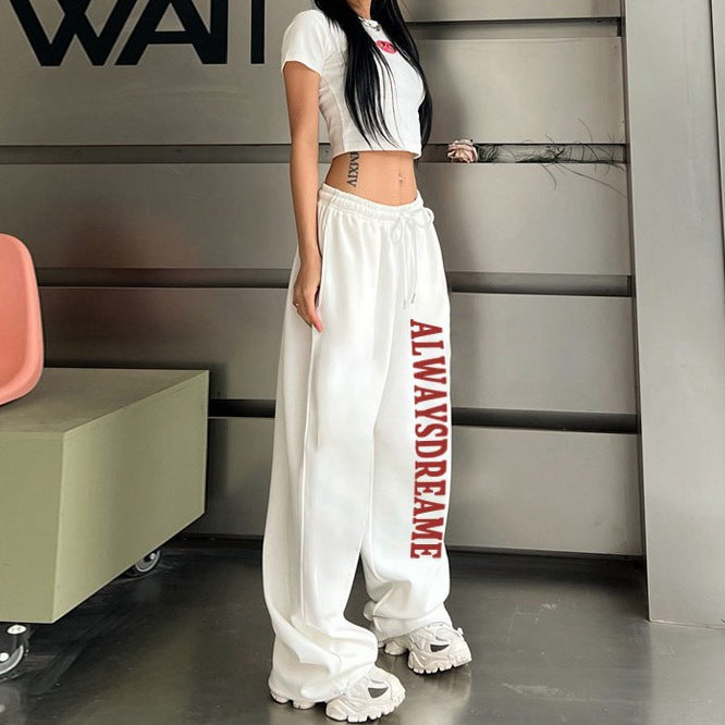 Women’s casual sweatpants with motivational lettering and elastic waistband Chic & Stil