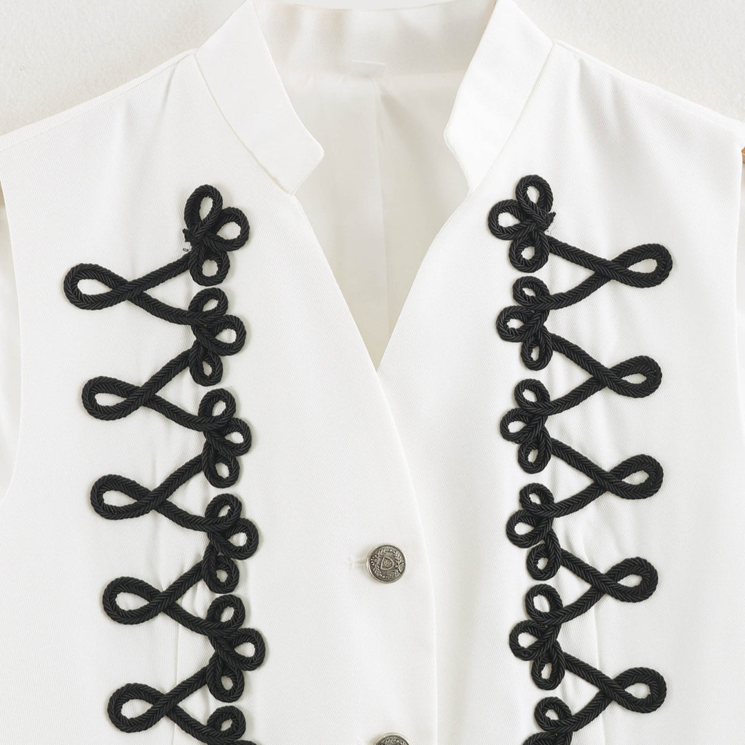 Women's sleeveless vest in uniform style with decorative frog closures and stand-up collar Amarae