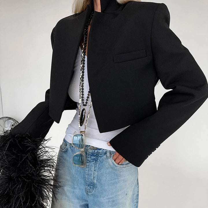 Short fitted jacket for ladies with a modern look featuring a high collar and elegant button details Lune London
