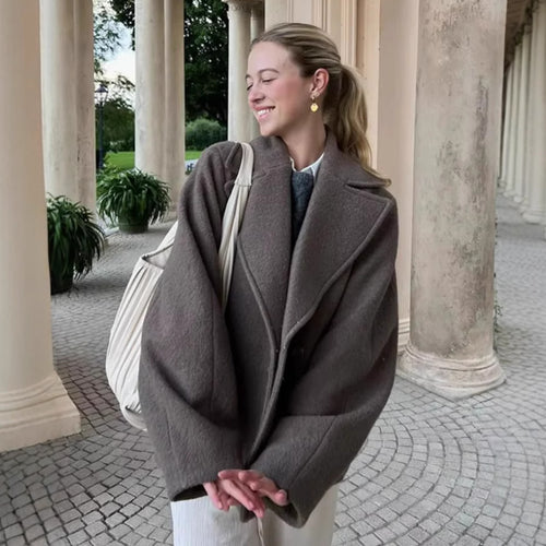 Elegant wool coat for women with deep lapels and practical pockets Amarae