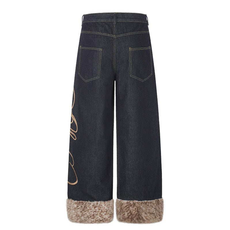 Women's denim palazzo pants with high waist, wide leg, side logo embroidery, and faux fur cuffs.