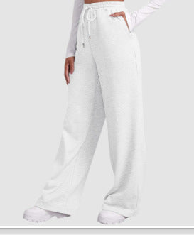 Women's loose-fitting leisure pants with elastic waistband and side pockets Chic & Stil