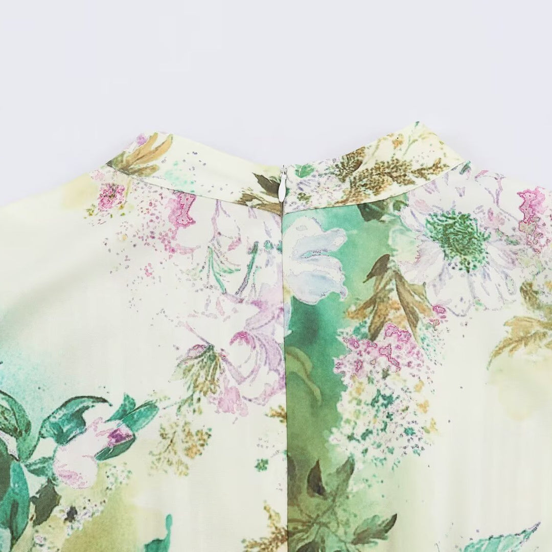 Women’s midi dress with pleated bodice, bell sleeves, and floral A-line skirt