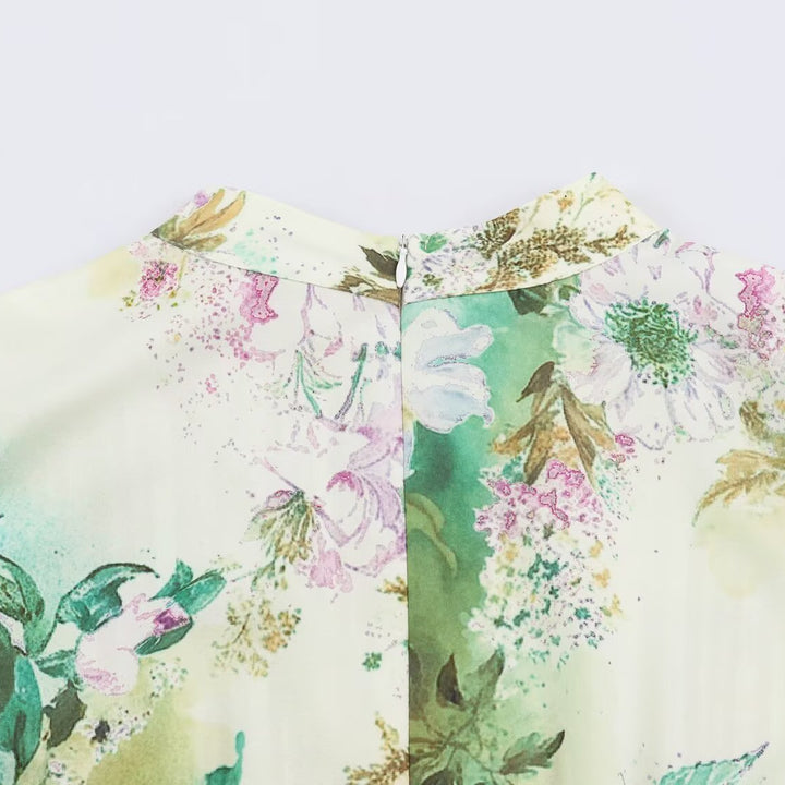 Women’s midi dress with pleated bodice, bell sleeves, and floral A-line skirt