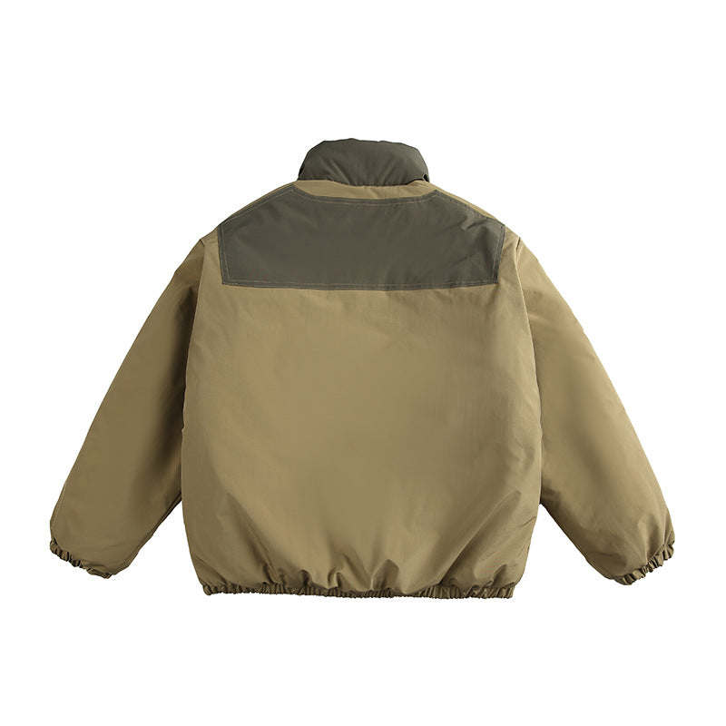 Unisex Boxy padded stand-up collar jacket with contrast panels, vertical chest zippers, and large flap pockets Amarae