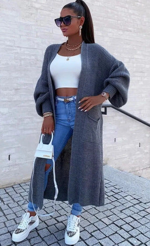 Long knitted coat for women with oversized sleeves and practical pockets Lune London
