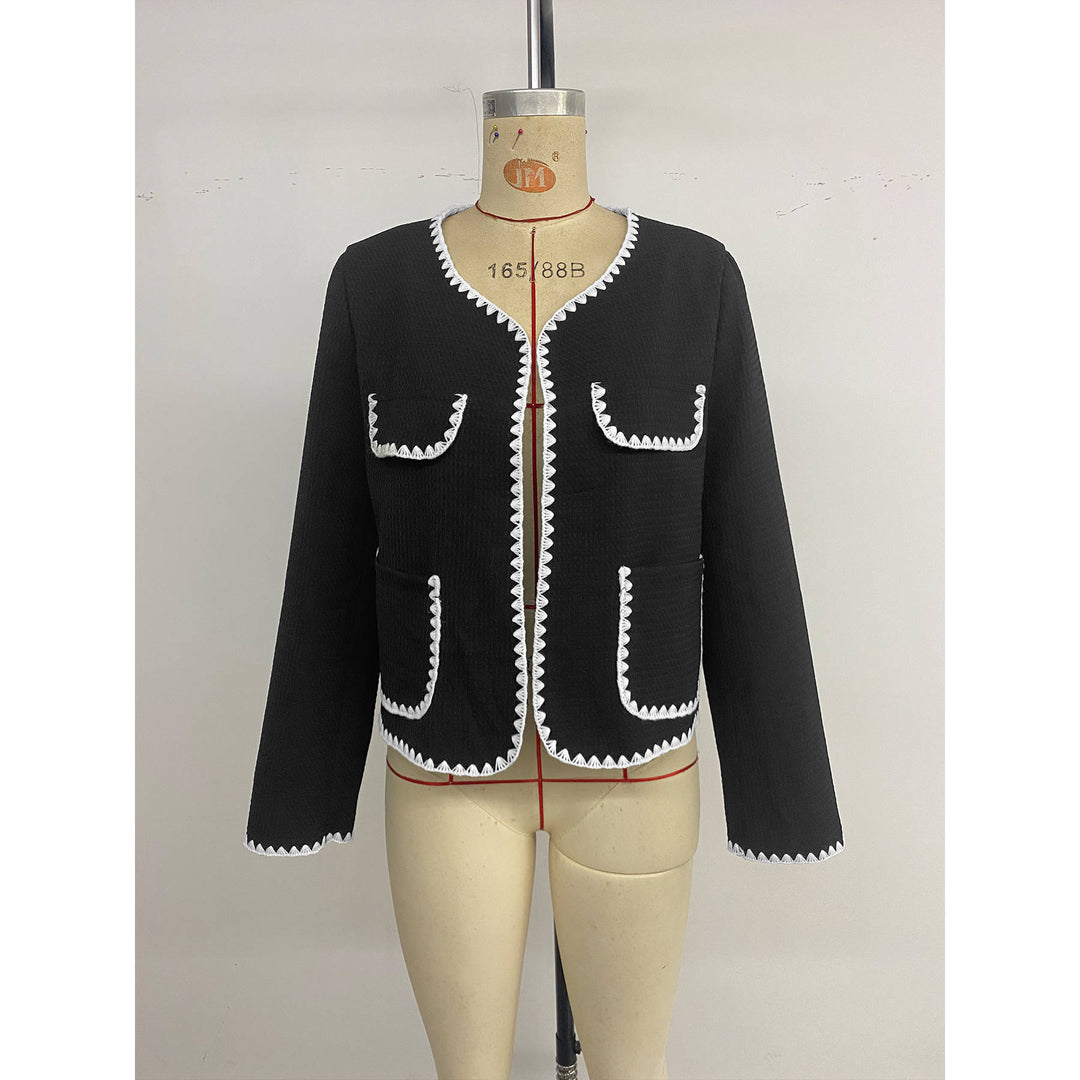 Elegant women's blazer jacket with short sleeves featuring contrasting piping embellishments and Lune London pockets