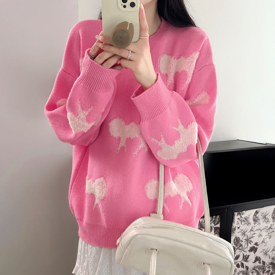 Cozy knitted sweater for women with playful bow pattern Lune London