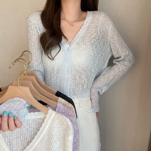 Women's casual cardigan with decorative button design and ribbed finishes
