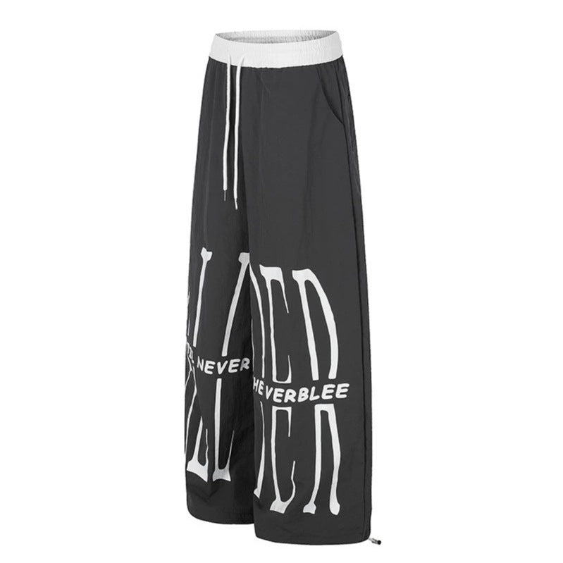 Women's wide loungewear pants with high comfort waistband, drawstring, adjustable hem, and typographic print Amarae