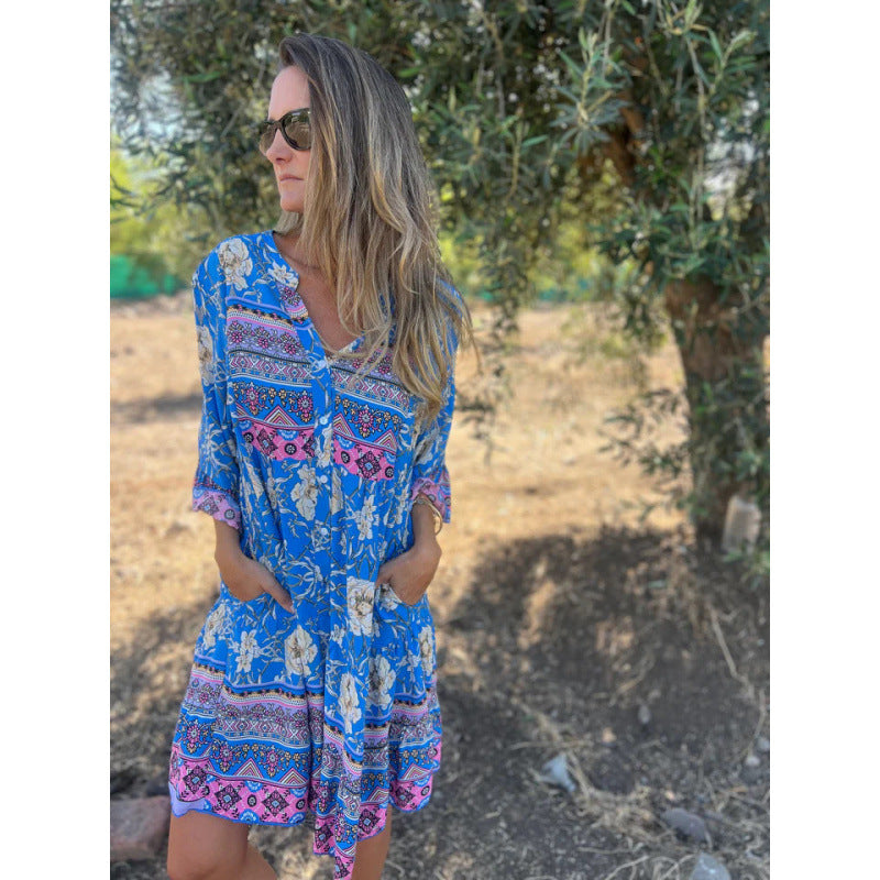 Casual blouse dress for women with a colorful floral pattern and a flared knee hem Lune London