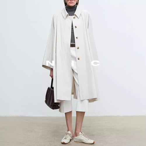 Manteau de trench décontracté pour femmes avec des manches surdimensionnées et des détails de boutons Chic & Stil