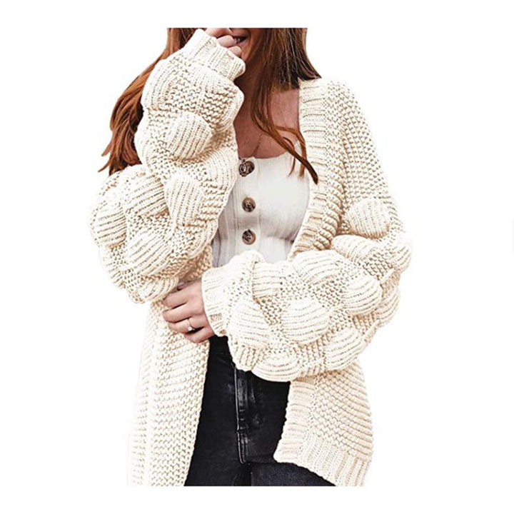 Knitted women's jacket with voluminous puff sleeves and a structured knit look Lune London