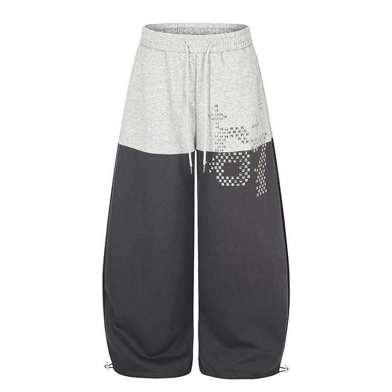 Women's Oversize Two-Tone Palazzo Sweatpants made of French Terry with logo studs, drawstring and adjustable hem.