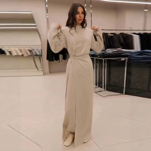 Women’s maxi dress with tailored silhouette, flared skirt and striking shoulders Amarae