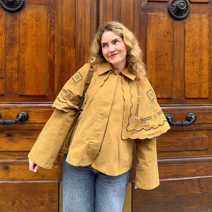 Women's short jacket with embroidered cape, eyelet embroidery and curved hem Amarae