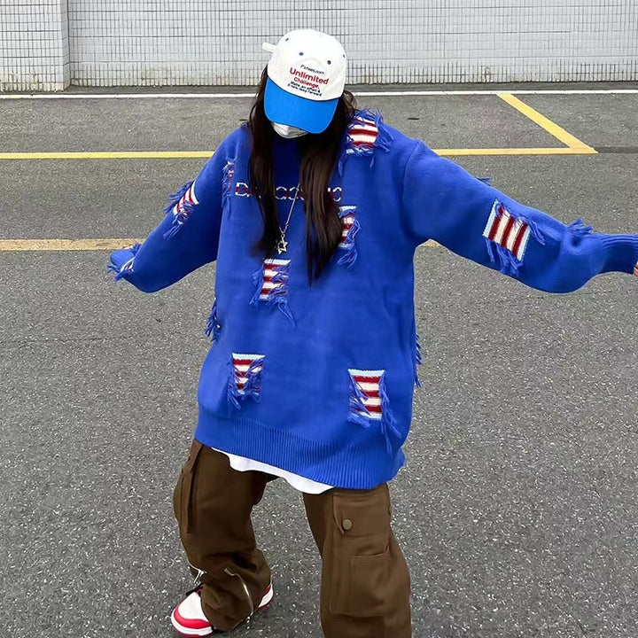 Urban knit pullover for women with unique ribbed details and a chic worn design