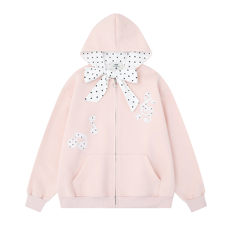 Women's hooded sweat jacket with polka dot hood lining, decorative bow, and music notes motif Amarae