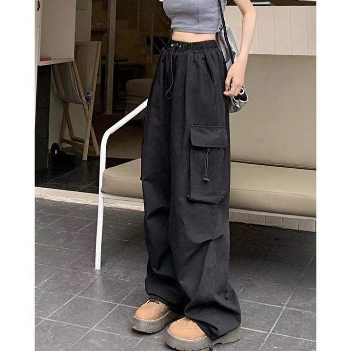 Women's cargo trousers with side pockets and elastic waistband Chic & Stil