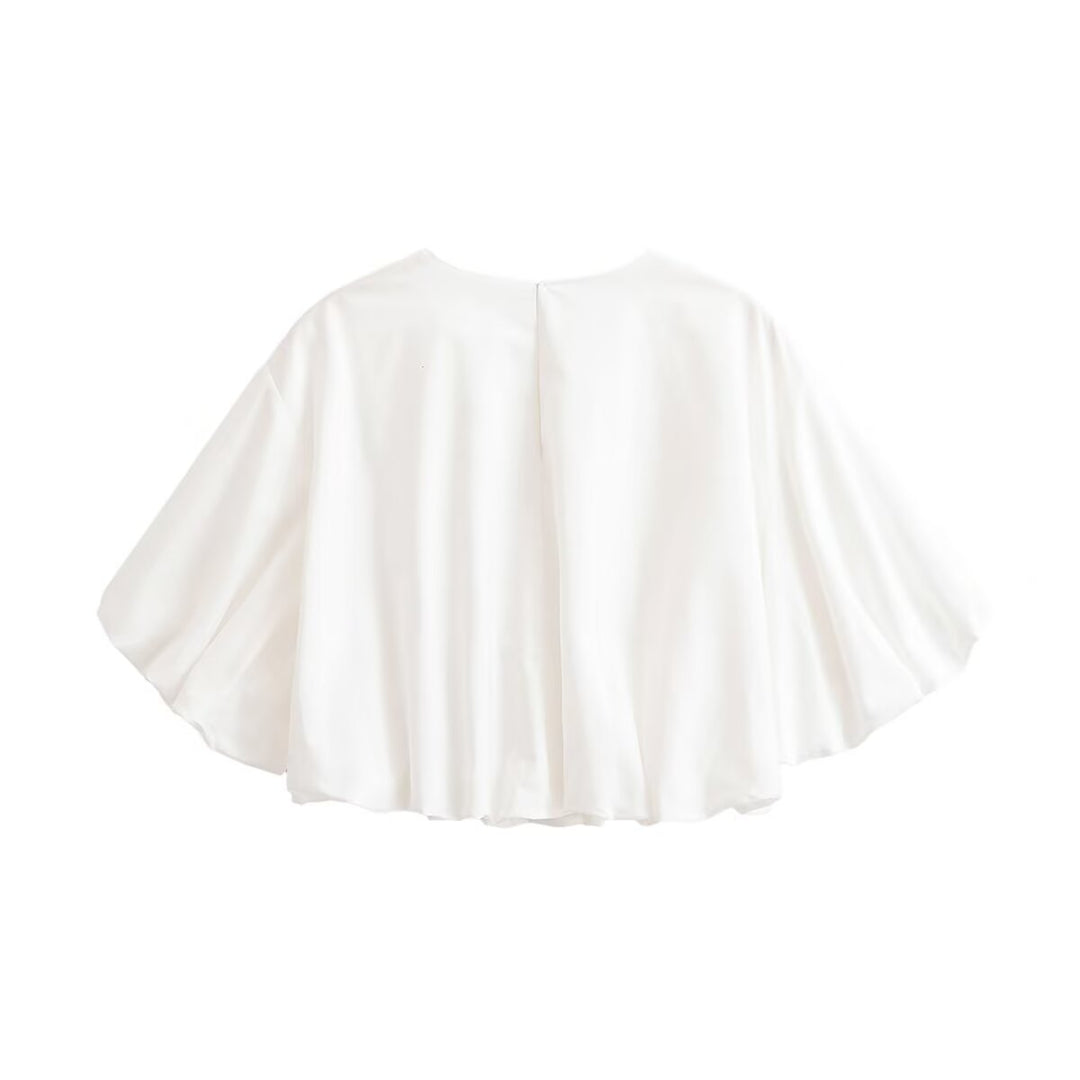 Women's loose cape top made of flowing satin with round neck