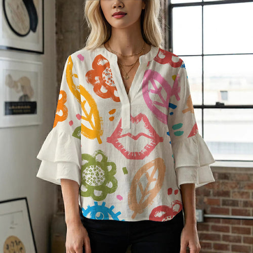 Women’s blouse with voluminous ruffled sleeves and floral pattern Amarae