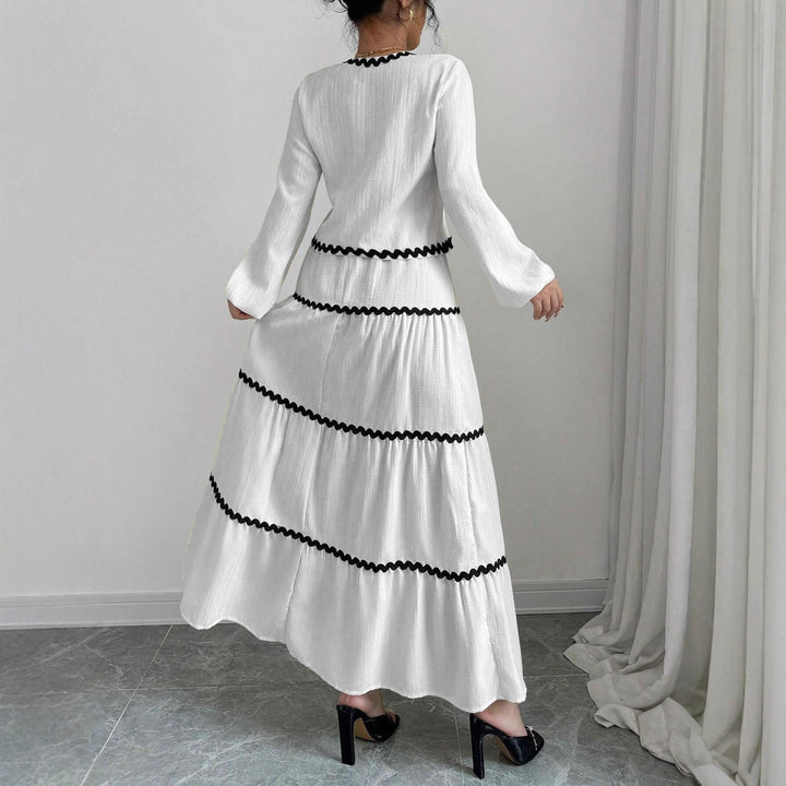 Maxi dress for women with playful lace-up neckline and elegant ruffled skirt Lune London