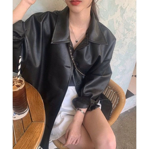 Women's fashionable leather jacket in oversized style with classic collar and decorative buttons Chic & Stil