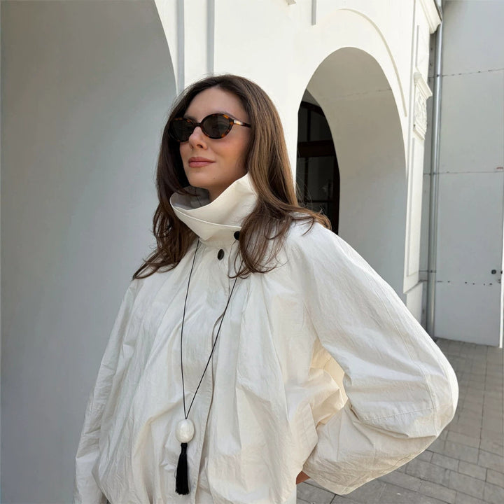 Women's short jacket with high stand-up collar, gathered shoulder area, and elastic hem Amarae